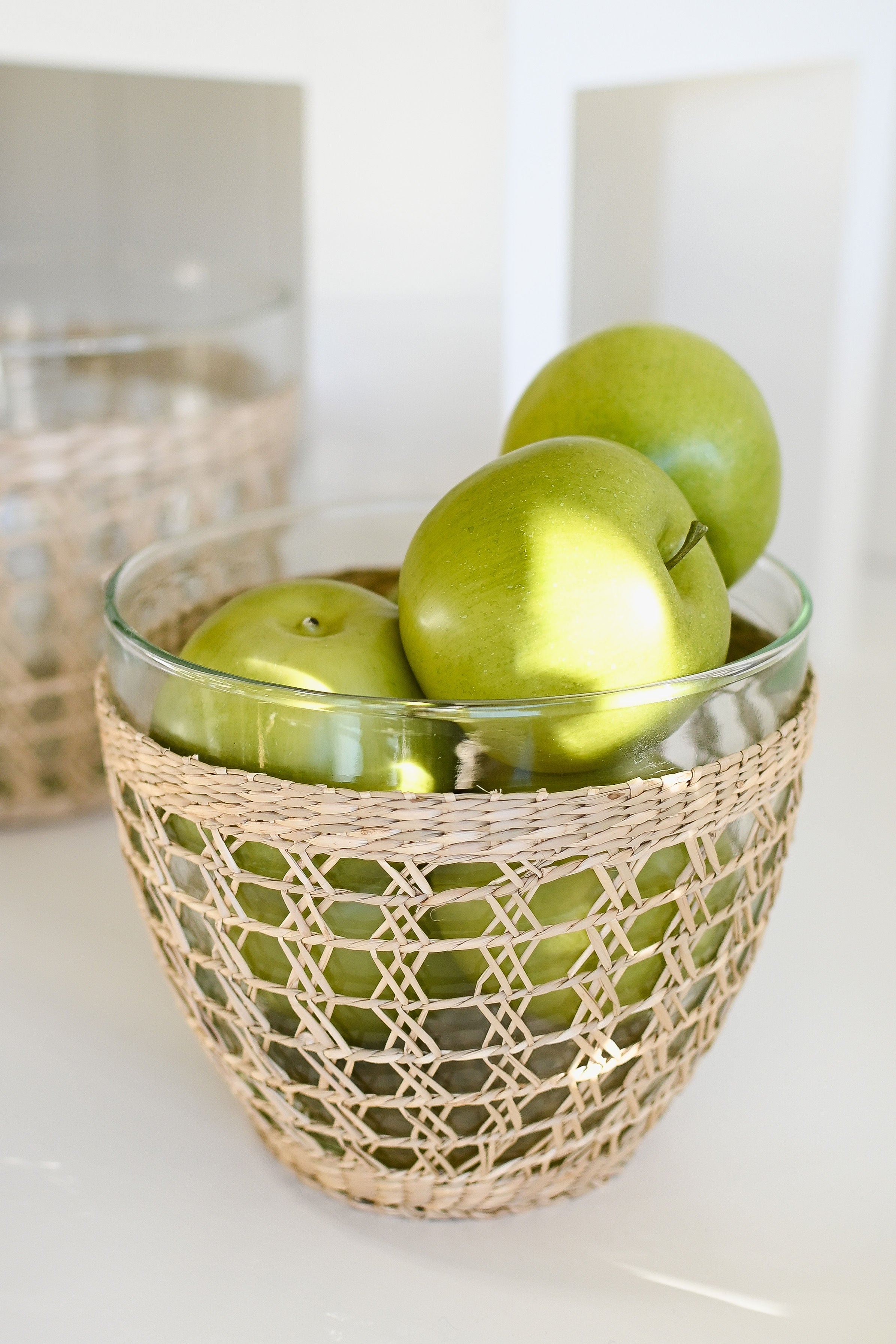 Looking for a fresh, classic look for your next dinner party or backyard barbecue? Check out our Seagrass Cage Salad Bowl! This beautiful bowl is crafted from recycled glass and features a natural seagrass wrap. It's perfect for serving salads, fruit, or even just using as decoration. Whether you're entertaining indoors or out, this bowl is sure to impress your guests.