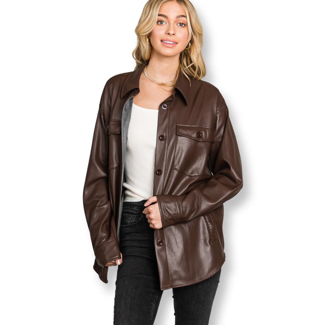 Introducing our Buttery Soft faux leather oversized shirt.  This luxurious piece is made from the finest quality faux leather, and is the perfect third piece. The Chocolate brown color is perfect for any outfit, and the 100% Polyurethane construction ensures that this jacket will stand up to wear and tear. 
