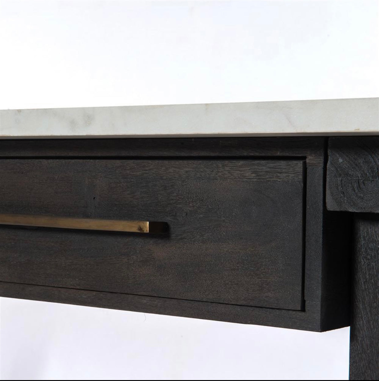 Sophisticated material mixes bring a classic French feel to the contemporary kitchen. Coalfinished mango wood supports a top of polished white marble for a clean look with alluring contrast, plus brass drawer pulls for vintage vibes.   36 inches high x 60 inches wide x 36 inches deep Constructed from acacia wood and marble Finished in black wood Features a coal-finished mango wood support a top of polished white marble Brass drawer pulls Weight: 353.4 pounds