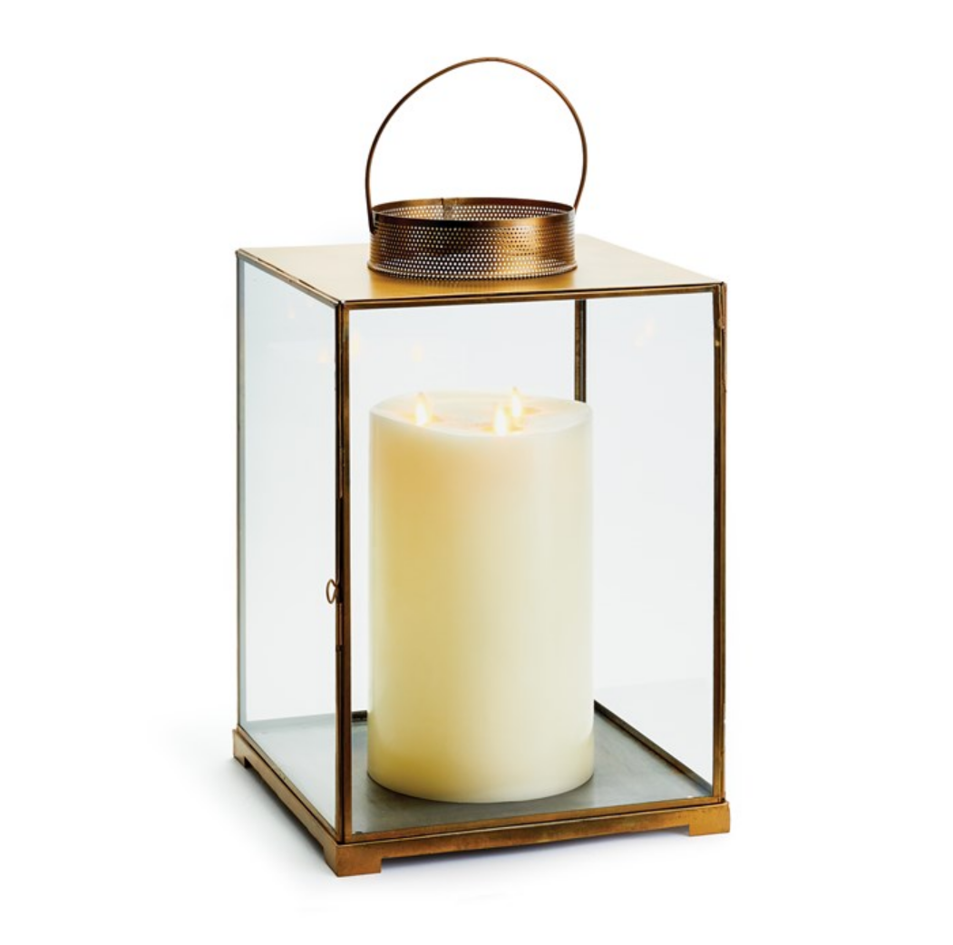 Constructed in warm antique brass, this lantern has classic lines and a simple design. With large, clear glass panes, the candlelight brightens the evening. Designed for interior use. Do not expose to the elements. Clean with a damp cloth. Avoid chemicals that may be harmful to finish. Never leave a burning candle unattended. Use only LED flameless candles when specified.  Dimensions: 10 x 10 x 15.75